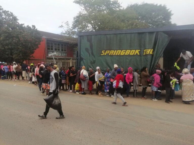 Community members line up to receive aid from STC Freight after the devastating Tongaat Tornado.