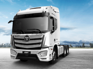 White Foton AUMAN EST AMT 6×4 heavy-duty truck parked on an open asphalt surface.